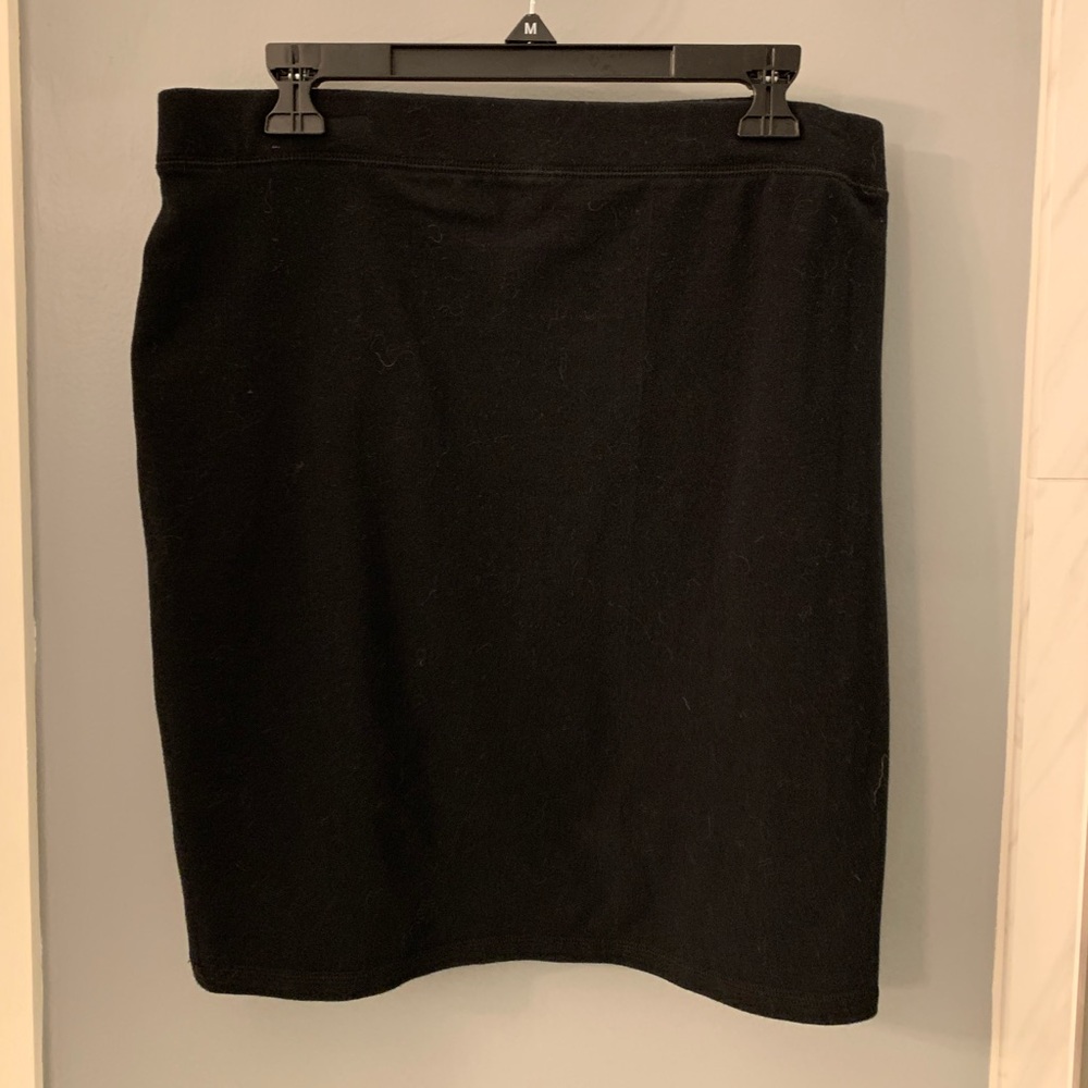 Knee length black skirt